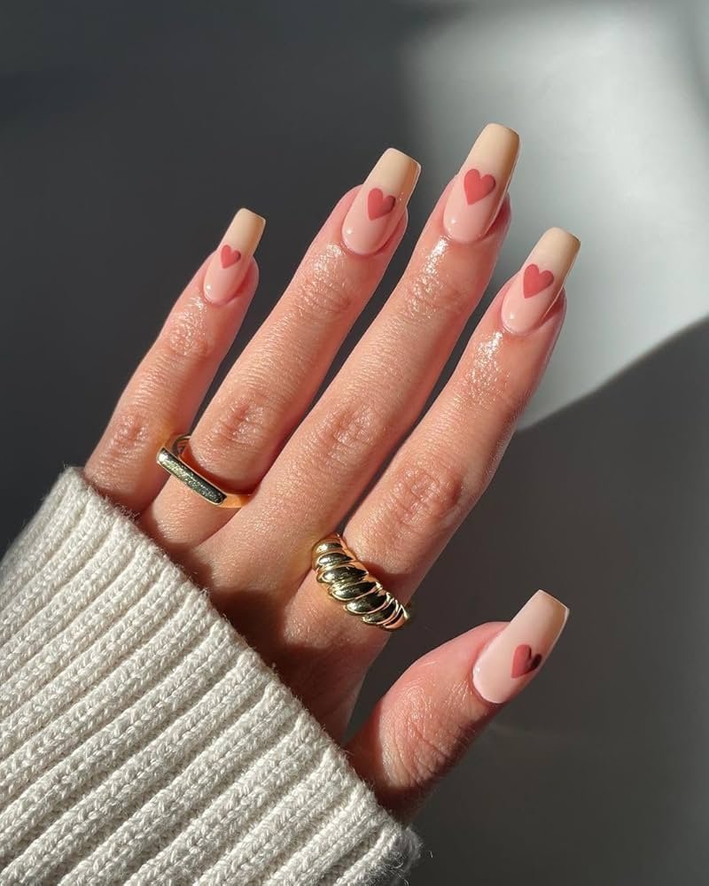 Nude nails with heart design